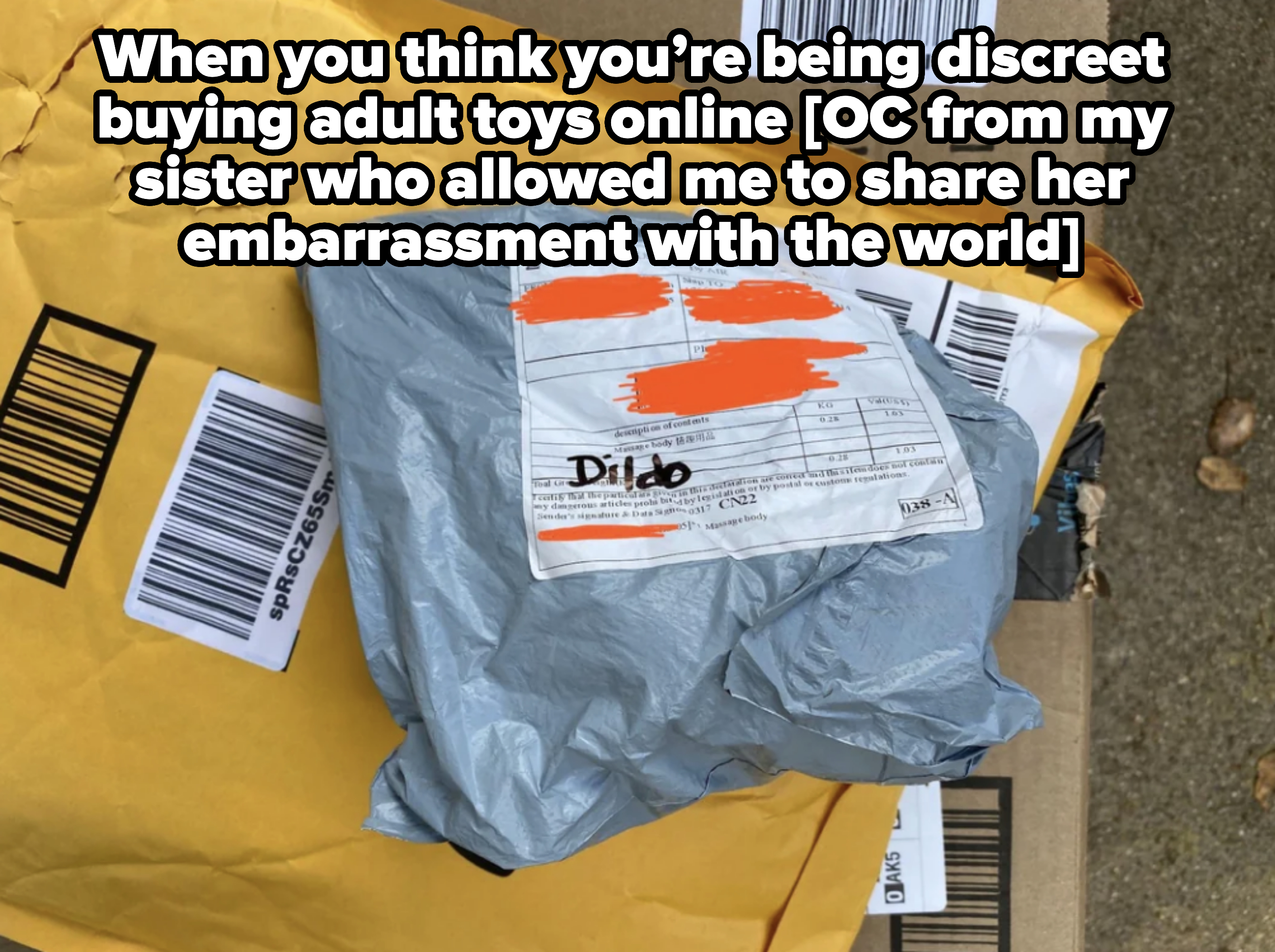 A package with a labeled customs form, partially covered, showing the word &quot;Dildo.&quot; The package is atop another unopened envelope on a concrete surface