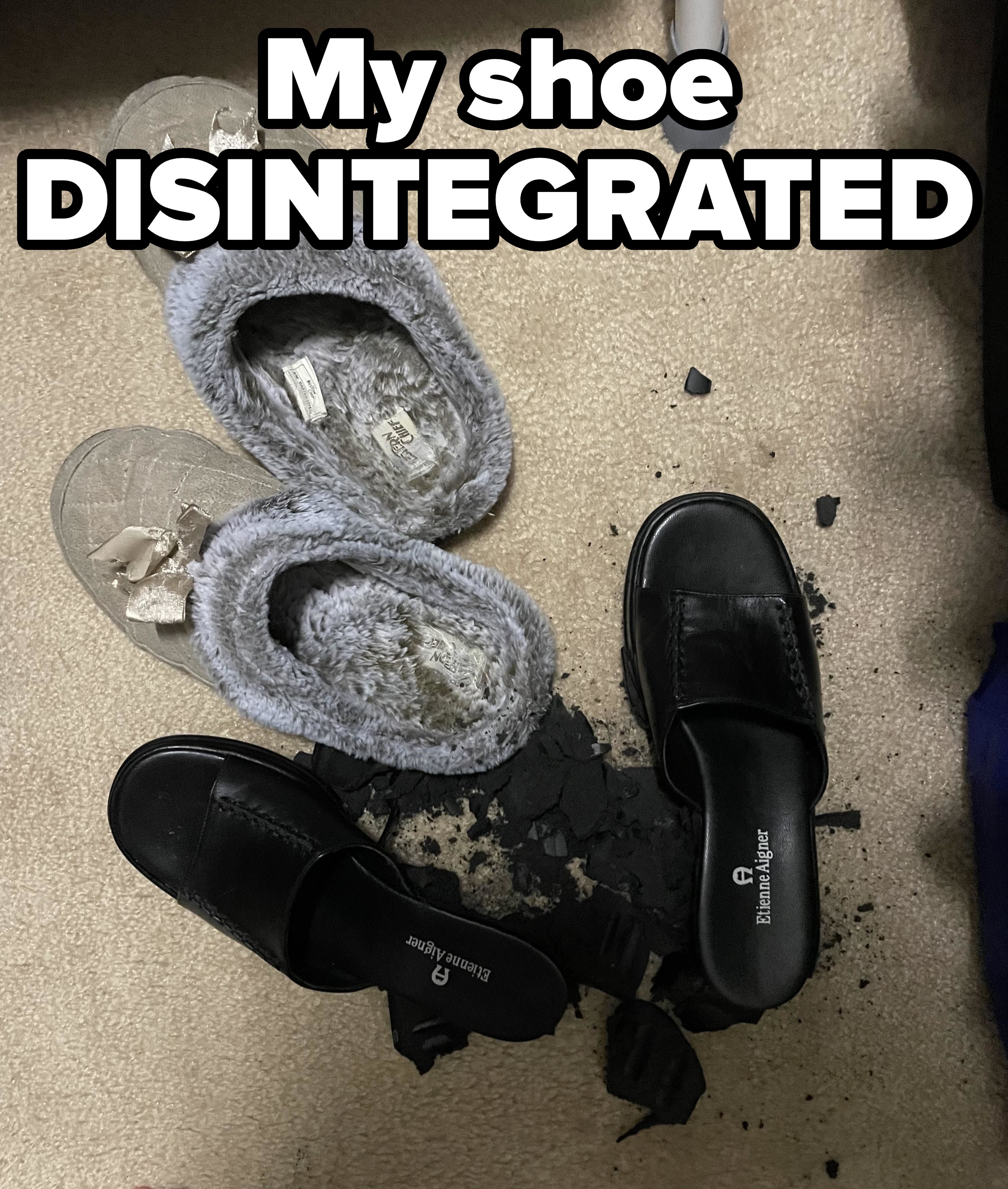 Two pairs of slippers and one pair of black shoes on a carpet, with some black debris scattered near the black shoes