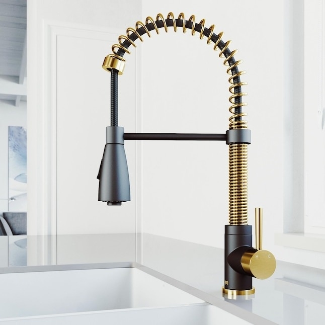 Modern kitchen faucet with a spring spout and a single lever handle. The faucet has a sleek, industrial design with metallic accents