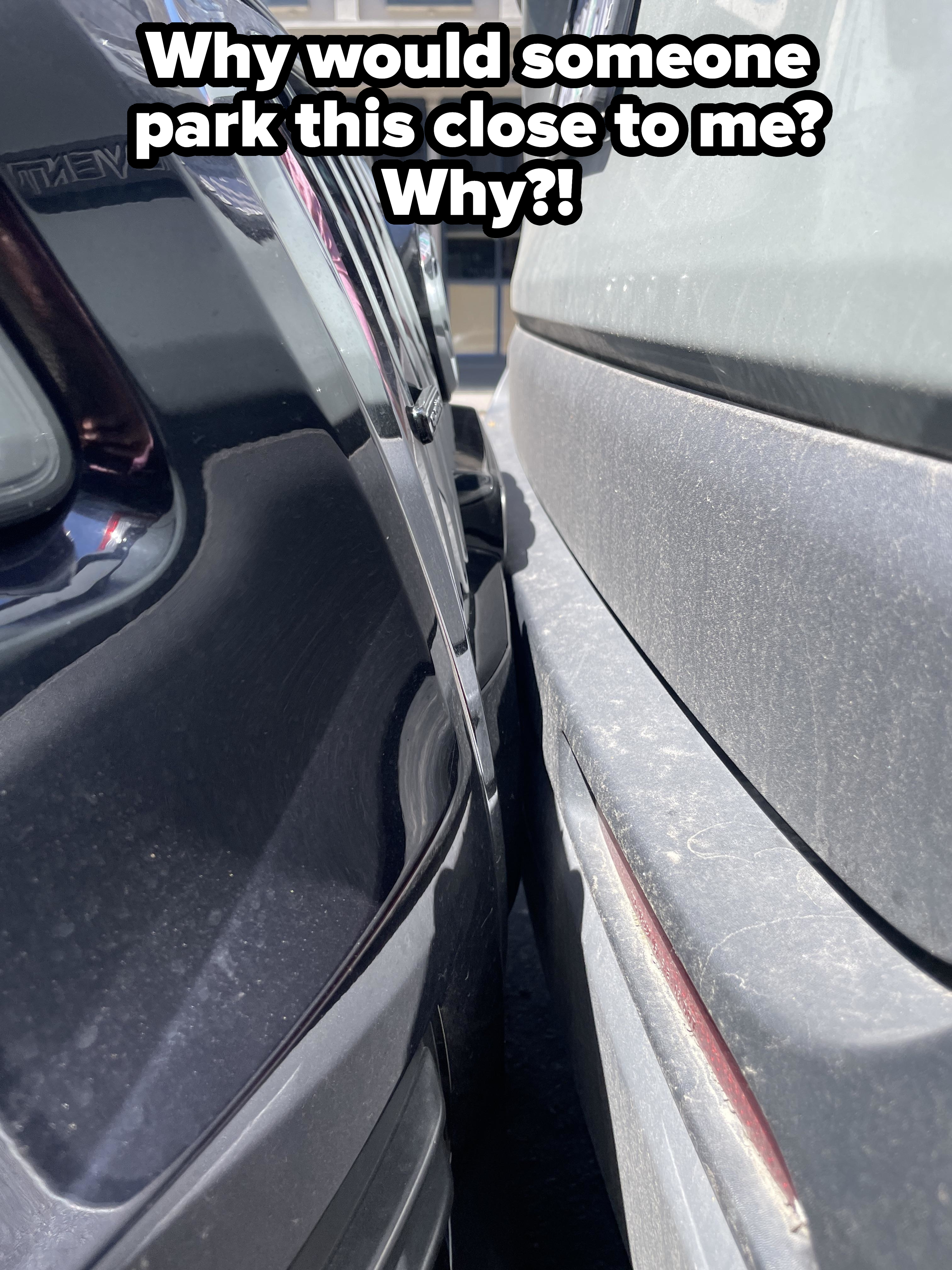 Two cars parked extremely close to each other, with barely any space between them. The scene suggests a highly tight parking situation