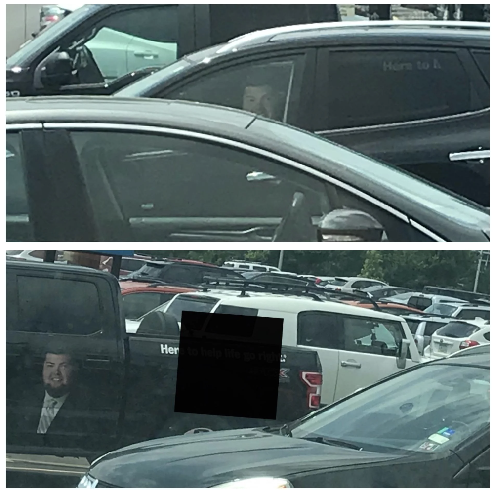 Parking lot filled with vehicles. The rear side of a truck has partial text: &quot;Here to help life go right.&quot; It displays an image of a man&#x27;s face