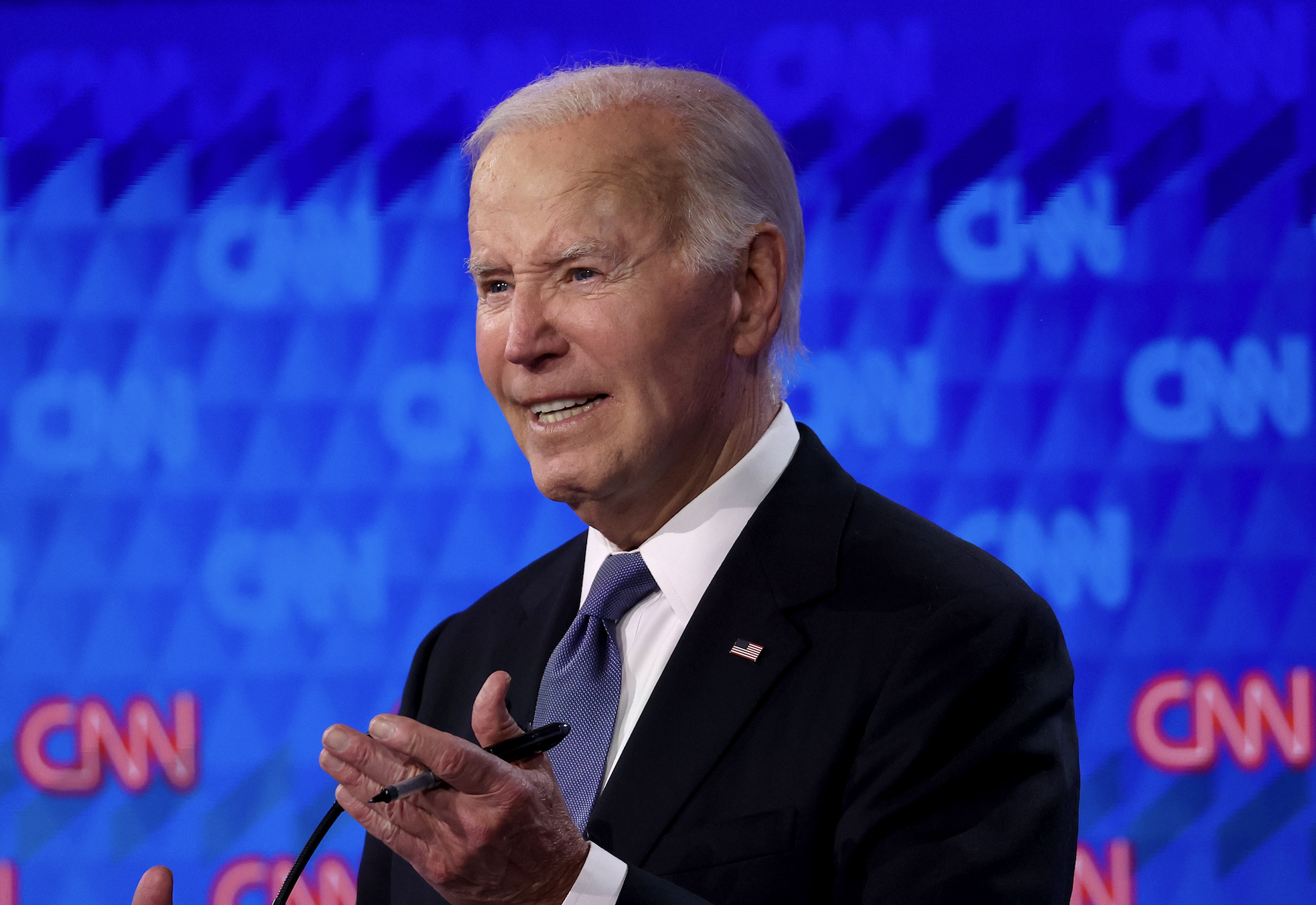 Joe Biden speaks at a CNN event, gesturing with his hands