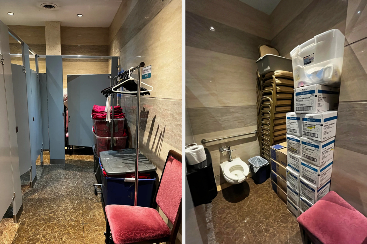 Two restroom stalls have been converted into storage spaces. The left stall holds cleaning supplies and linens, while the right stall is filled with various stacking boxes and chairs