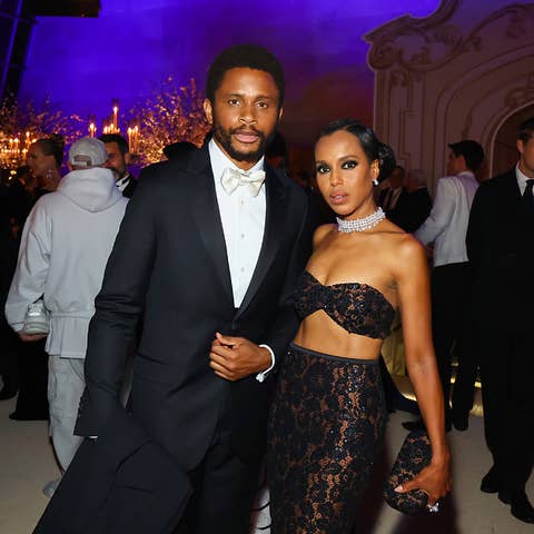 Kerry Washington and Nnamdi Asomugha at a formal event. Kerry wears a laced evening gown, and Nnamdi wears a bow-tied tuxedo. They are posing together