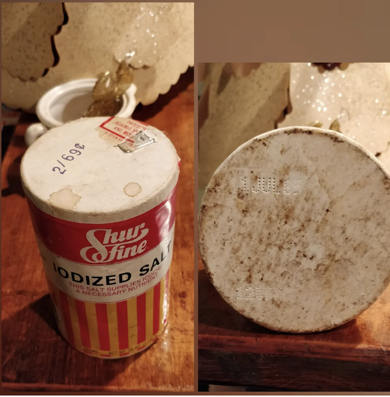 A canister of Shur Fine iodized salt with a red and yellow label is shown. The canister appears aged with some signs of wear and expiration date visible at the bottom