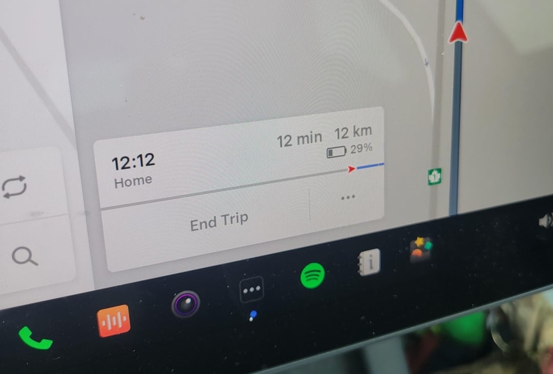 Navigation screen showing a route with 12 minutes, 12 km left to destination and the time is 12 12
