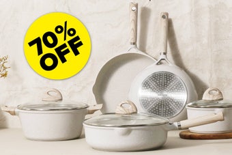 Set of pots and pans with wooden handles and glass lids, displayed against a light-colored background. A yellow circular sign reads "70% OFF."