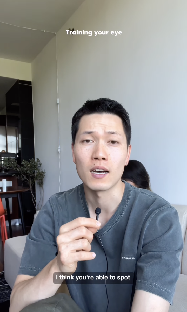 Young man holding a microphone, talking to the camera in a living room. Partial text reads &quot;Training your eye&quot; and &quot;I think you&#x27;re able to spot&quot;