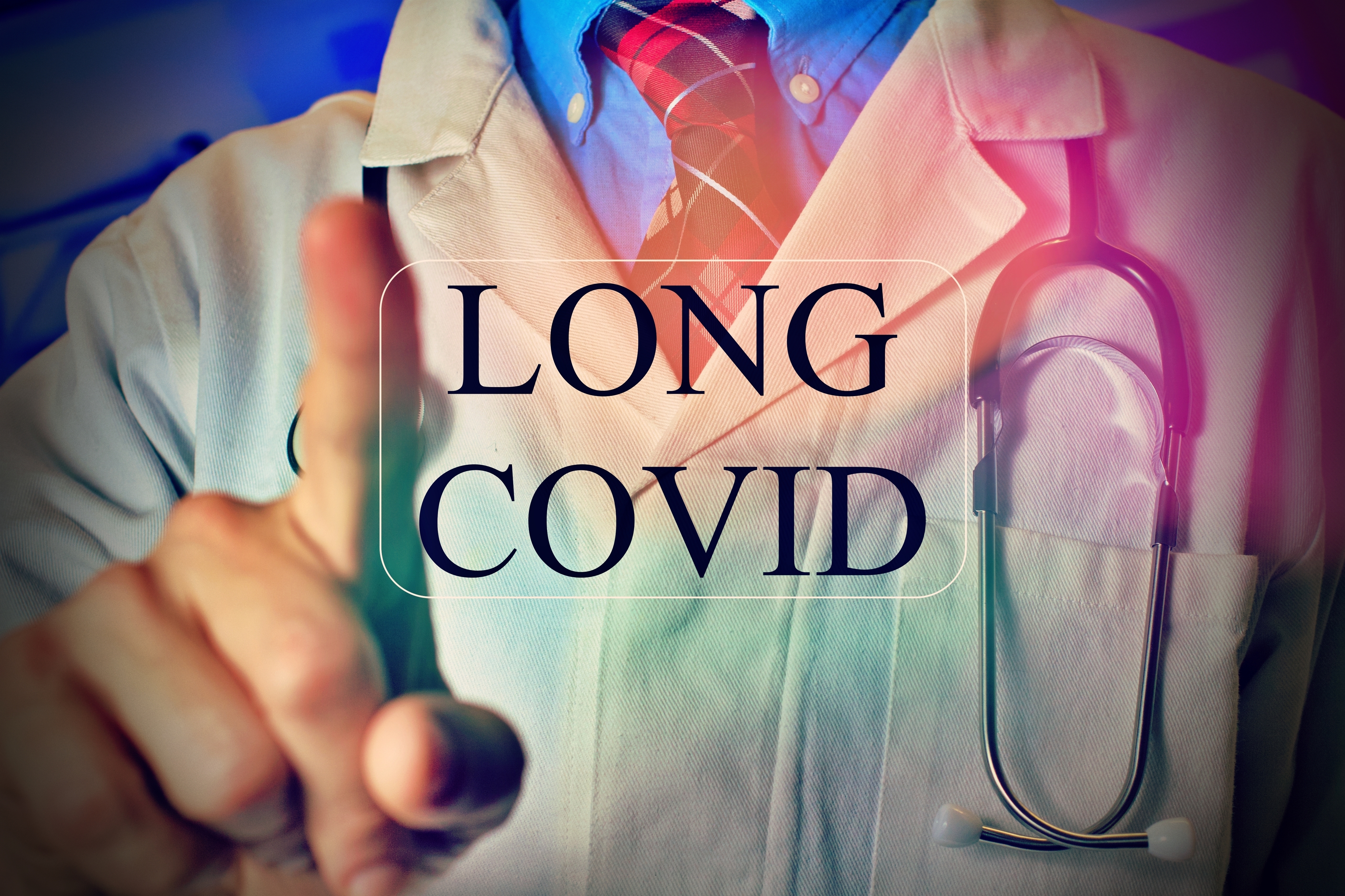 A doctor pointing towards the camera with a stethoscope around the neck. Text overlay reads &quot;LONG COVID&quot;