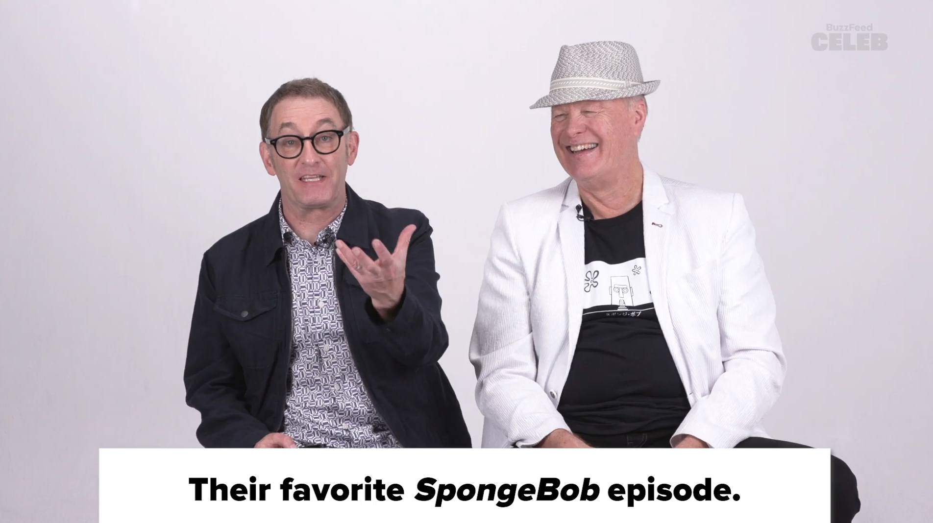 Tom Kenny and Bill Fagerbakke sitting together, smiling, discussing their favorite SpongeBob episode for BuzzFeed Celeb