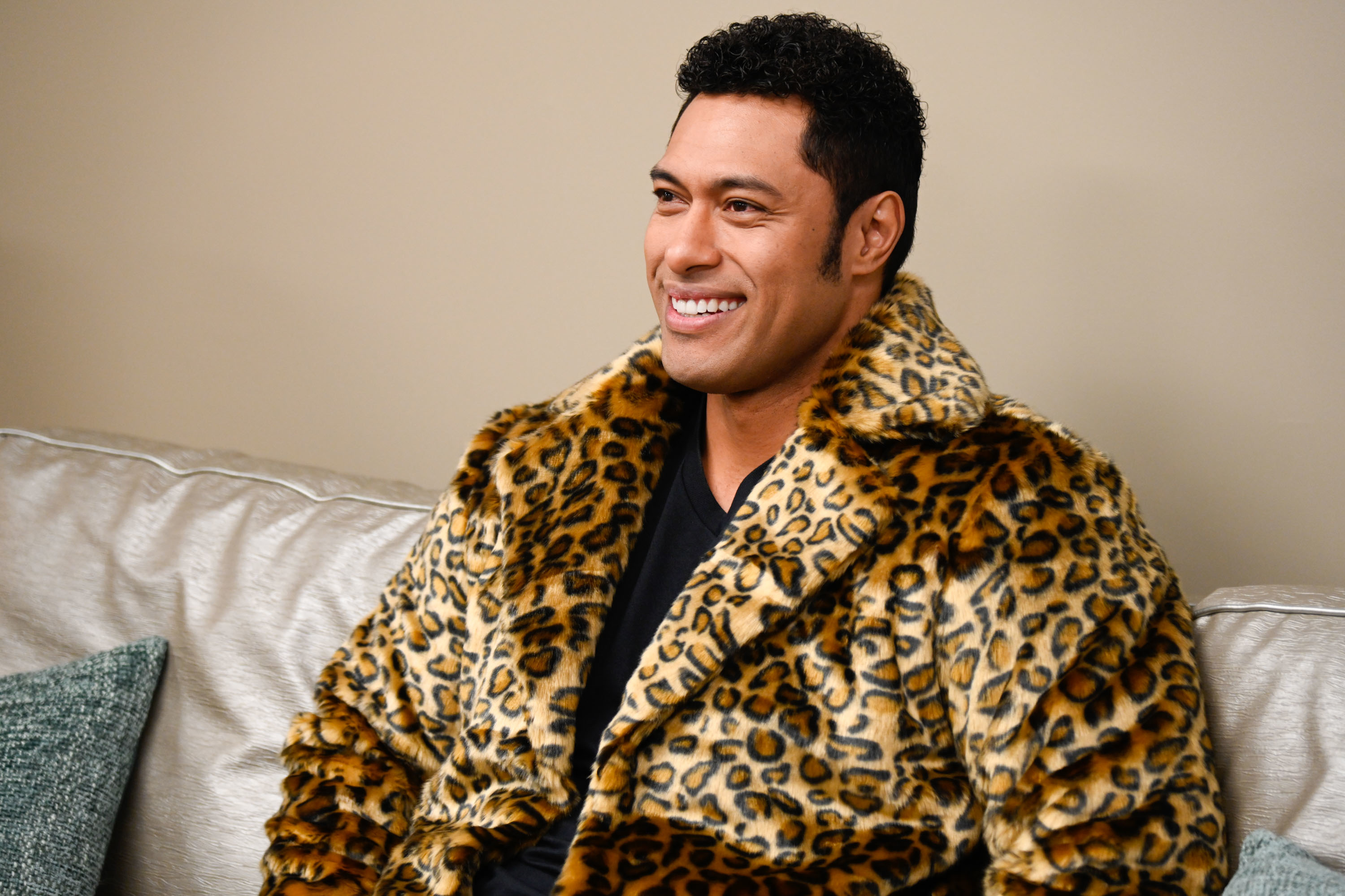 Uli Latukefu in a leopard jacket as Dwayne Johnson in a scene from &quot;Young Rock&quot;