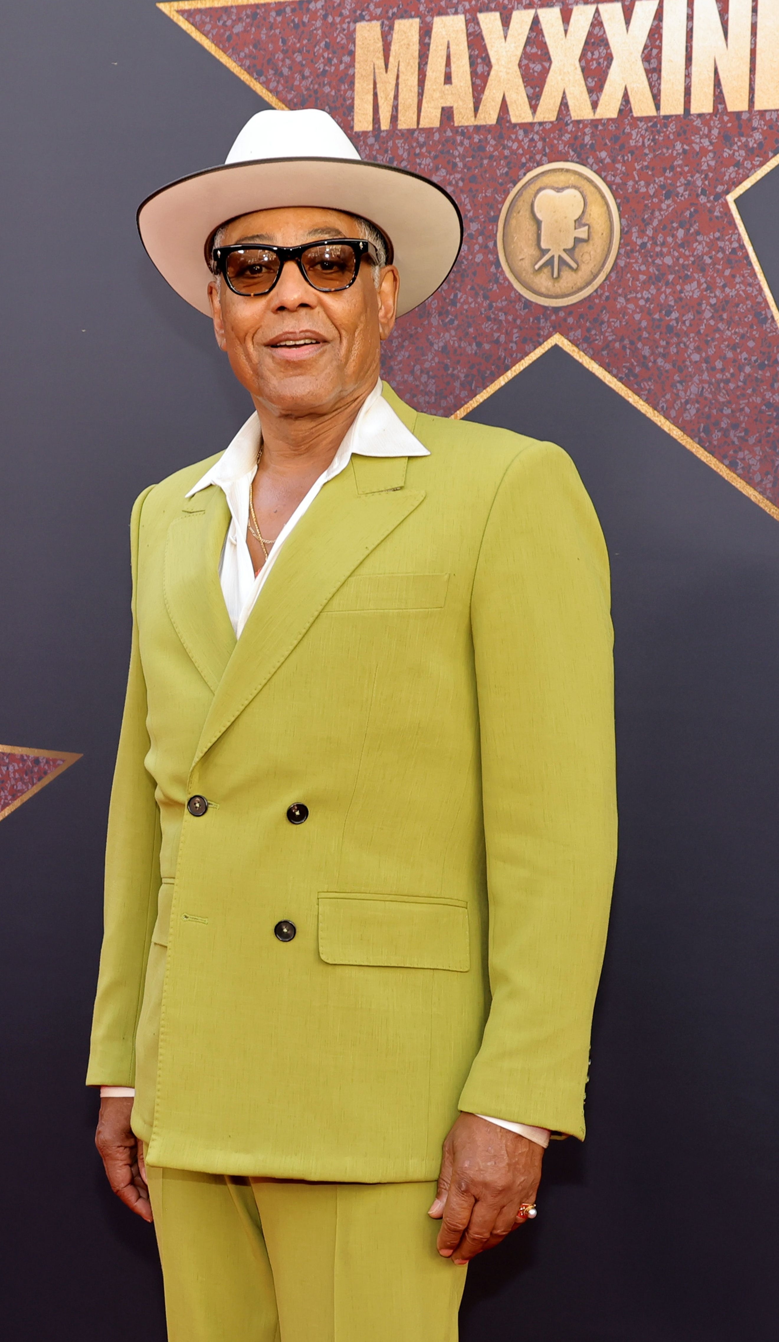 Giancarlo Esposito in a lime green suit and fedora hat the premiere of &quot;MaXXXine&quot;