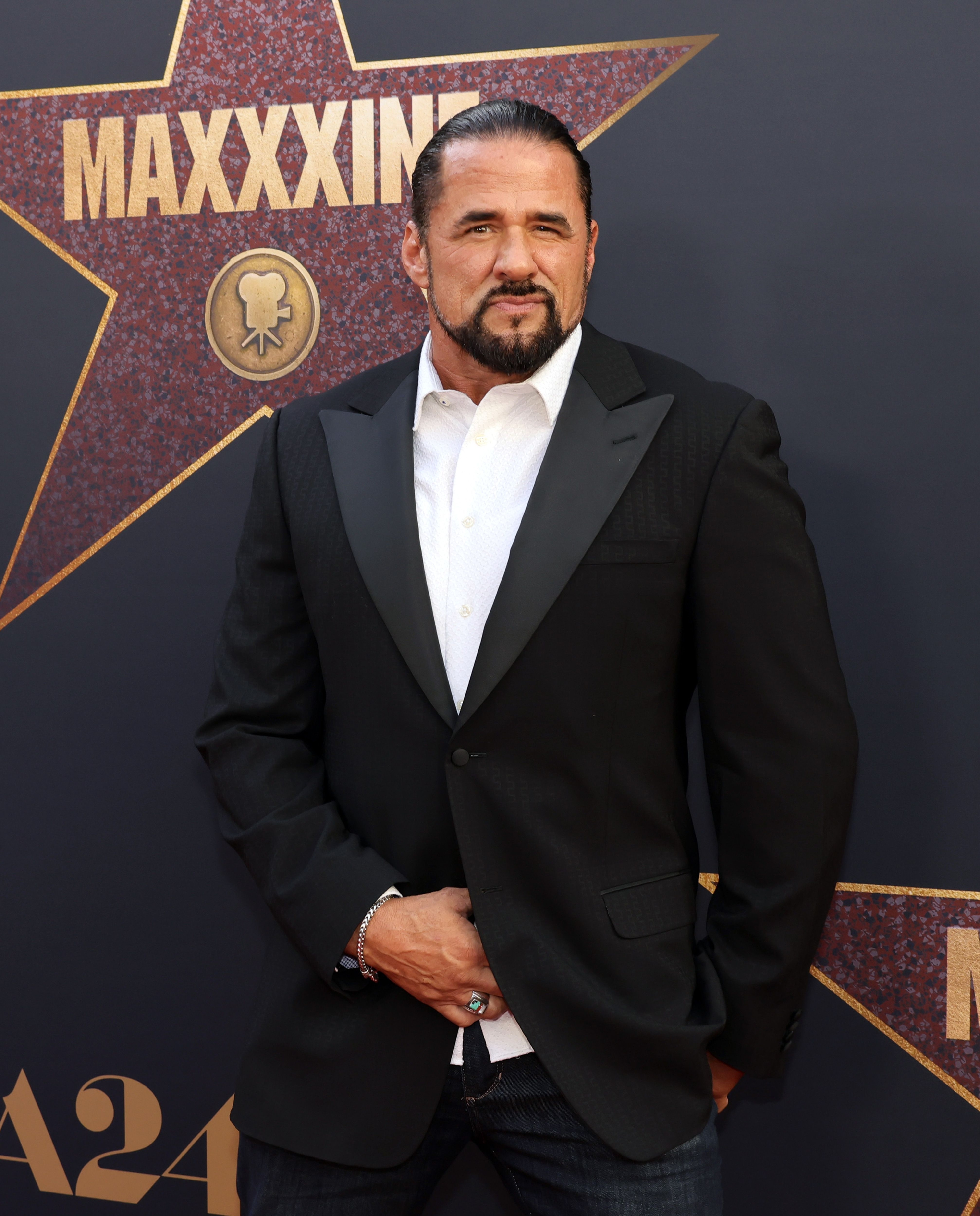 Marcus LaVoi in a suit and tie at the premiere of &quot;MaXXXine&quot;