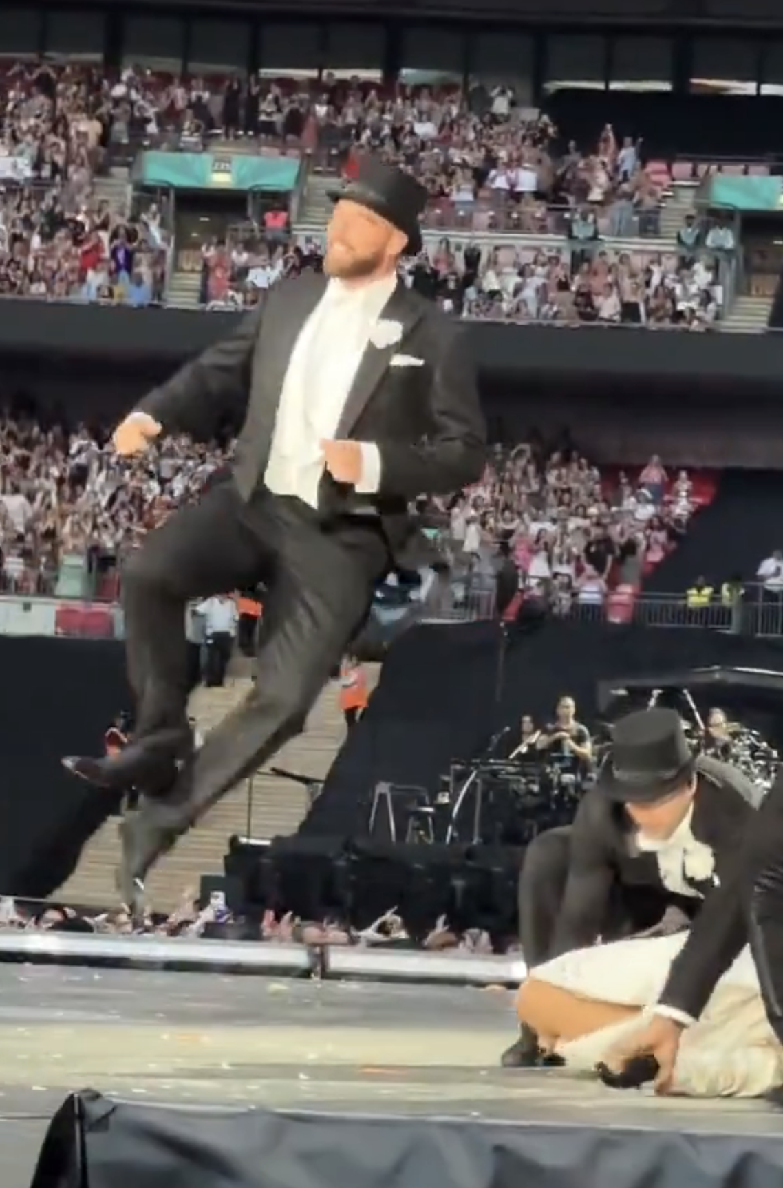 Travis Kelce on stage at Taylor Swift&#x27;s Eras Tour concert