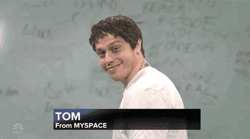 Pete Davidson as Tom from MySpace on SNL, smiling and turning towards the camera in a white shirt. Text on the screen reads &quot;TOM From MYSPACE&quot;