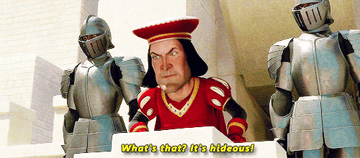 Lord Farquaad, flanked by two armored knights, exclaims, &quot;What&#x27;s that? It&#x27;s hideous!&quot; This scene is from the animated movie Shrek