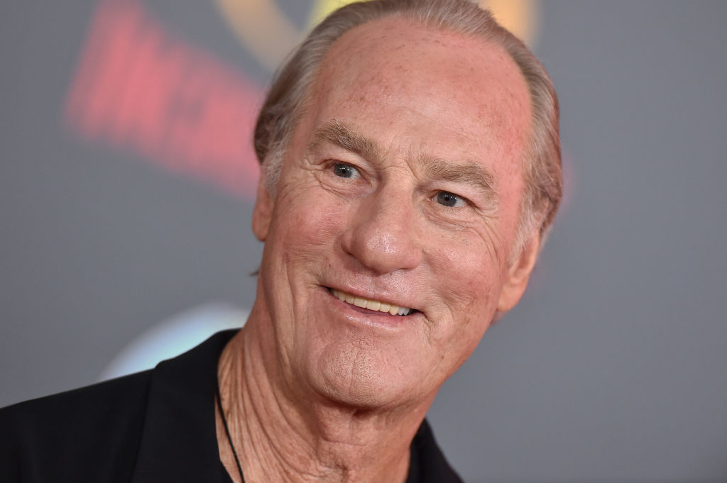 Craig T. Nelson smiling at an event, wearing a black jacket