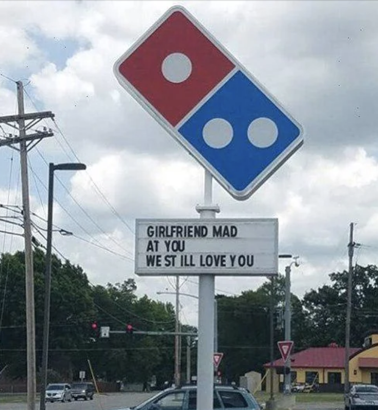 Domino&#x27;s Pizza sign reads: &quot;GIRLFRIEND MAD AT YOU, WE STILL LOVE YOU.&quot;
