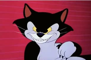 Animated cat Lucifer from Cinderella grinning mischievously against a plain background