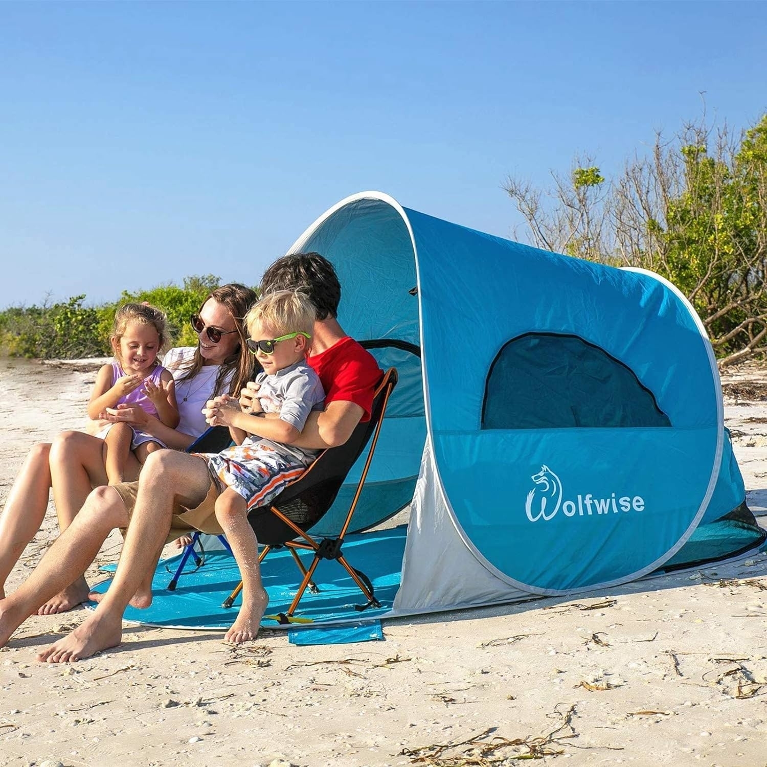 a family using the pop-up tent