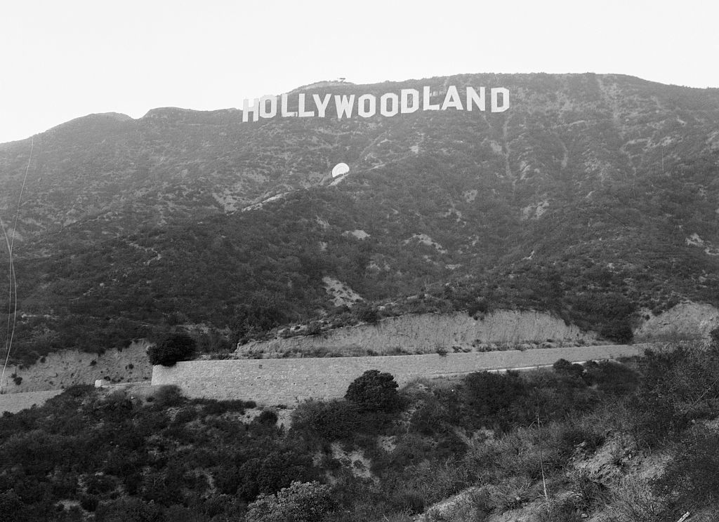 Black and white image of the original &quot;Hollywoodland&quot; sign on the hillside in Los Angeles, CA