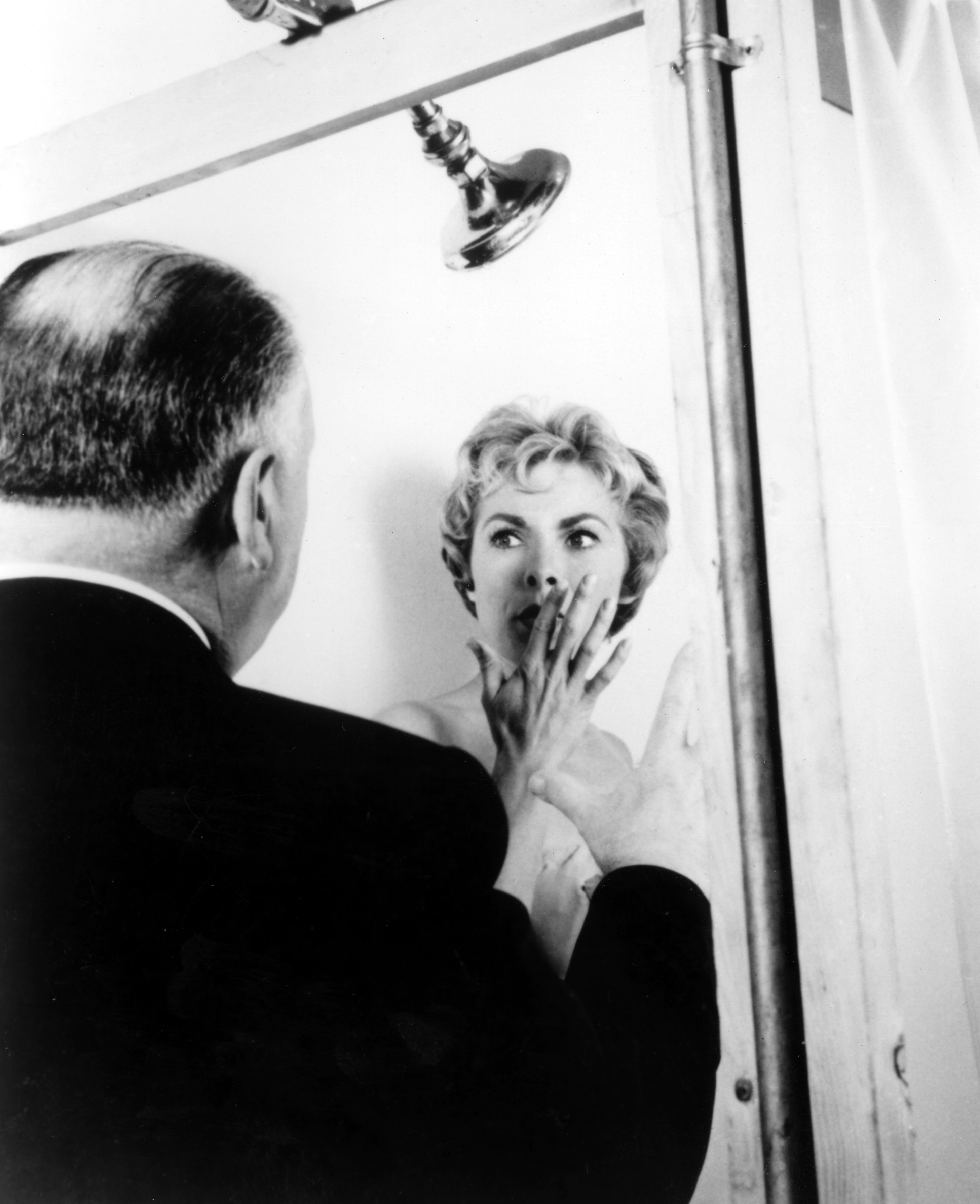 Alfred Hitchcock directs Janet Leigh in the iconic shower scene from the film &quot;Psycho.&quot;