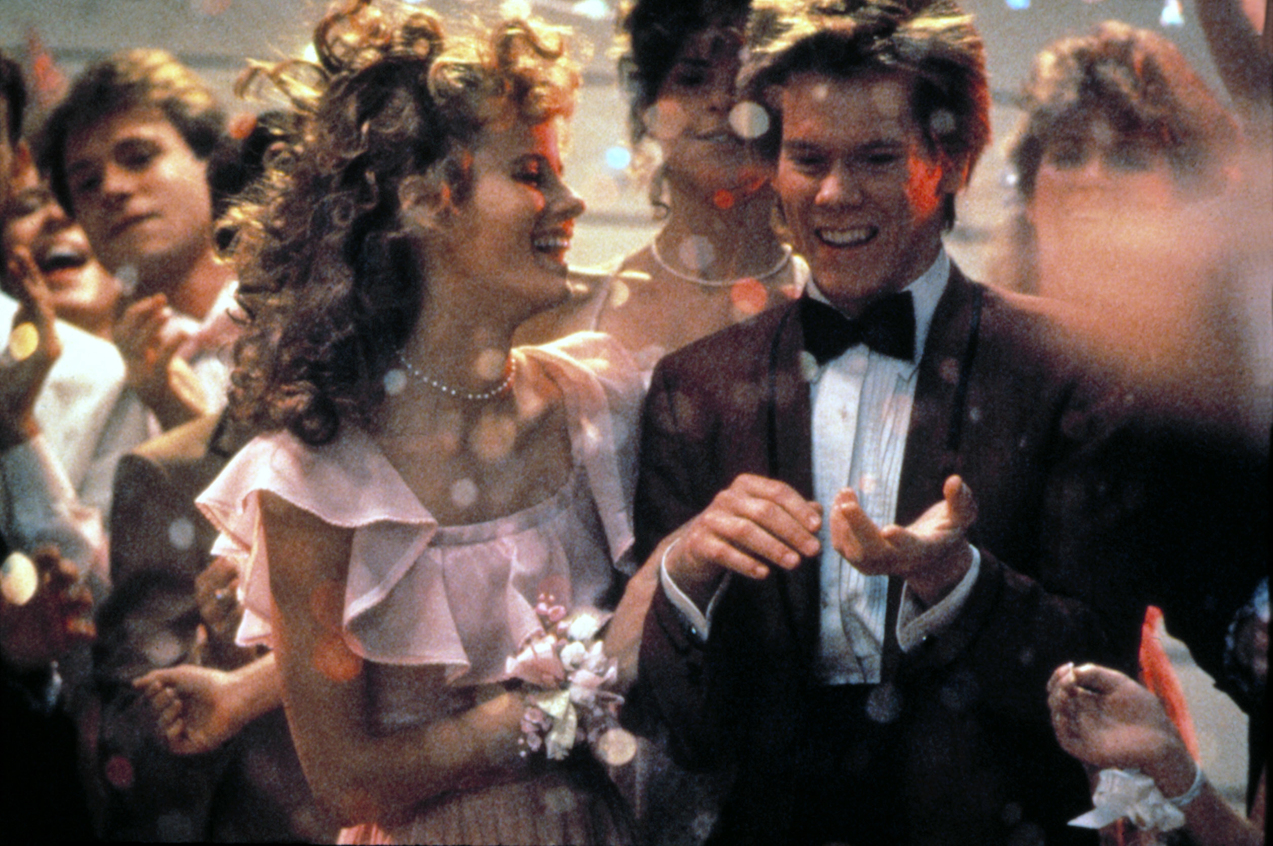 Kevin Bacon and Lori Singer in formal attire in a scene from &quot;Footloose&quot;