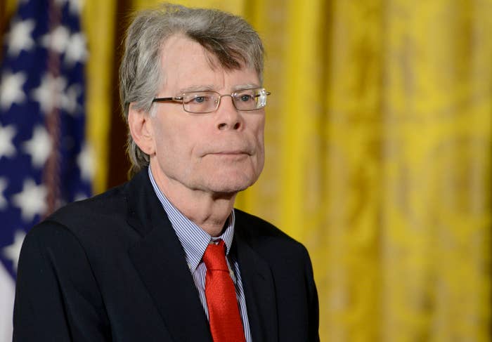 Stephen King in a suit and tie at an event