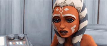 Ahsoka Tano from &quot;Star Wars: The Clone Wars&quot; animated series looks concerned while speaking near a control panel