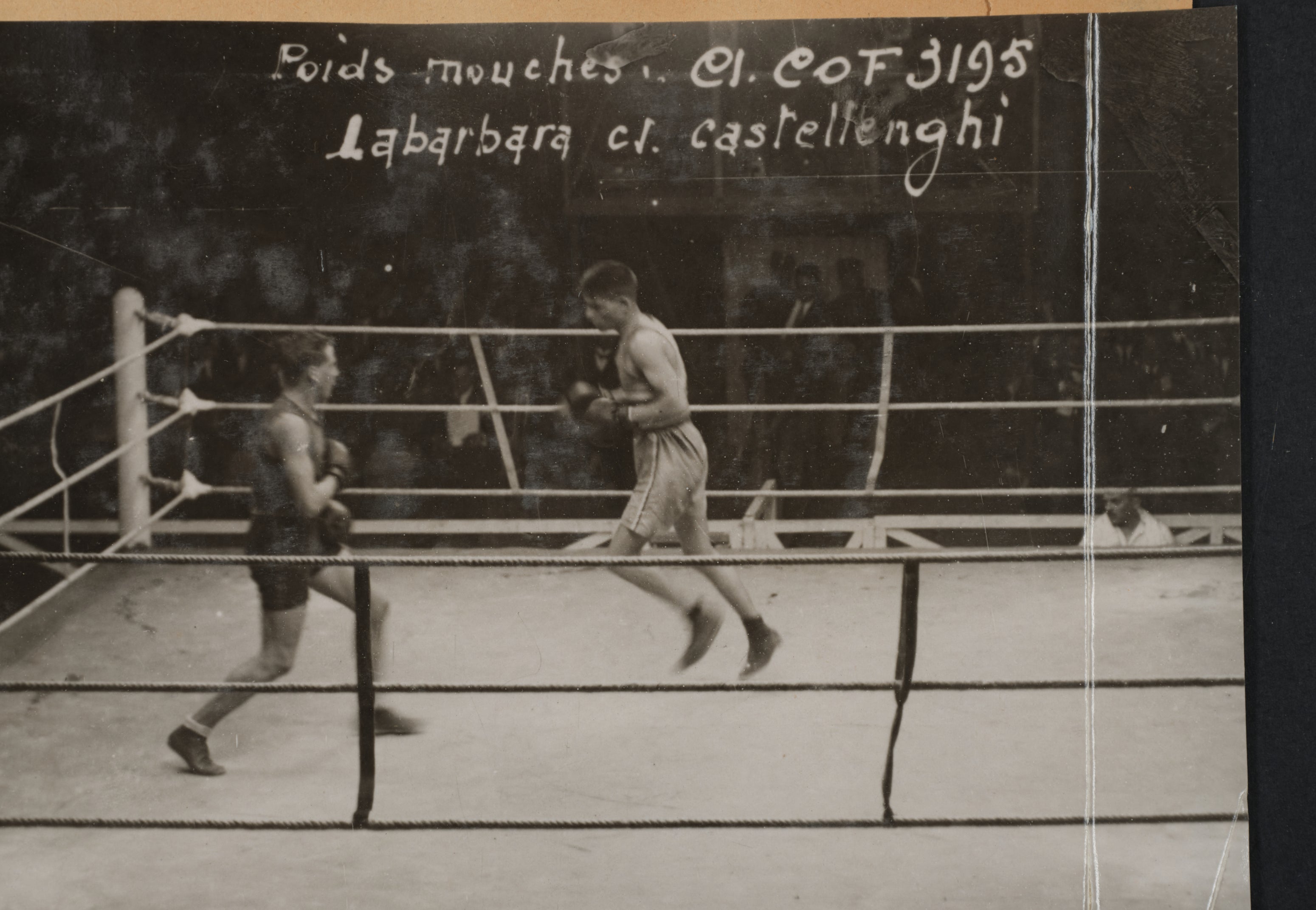 Olympic Boxers William H. Smith and Jean Ces in action during a match in a boxing ring