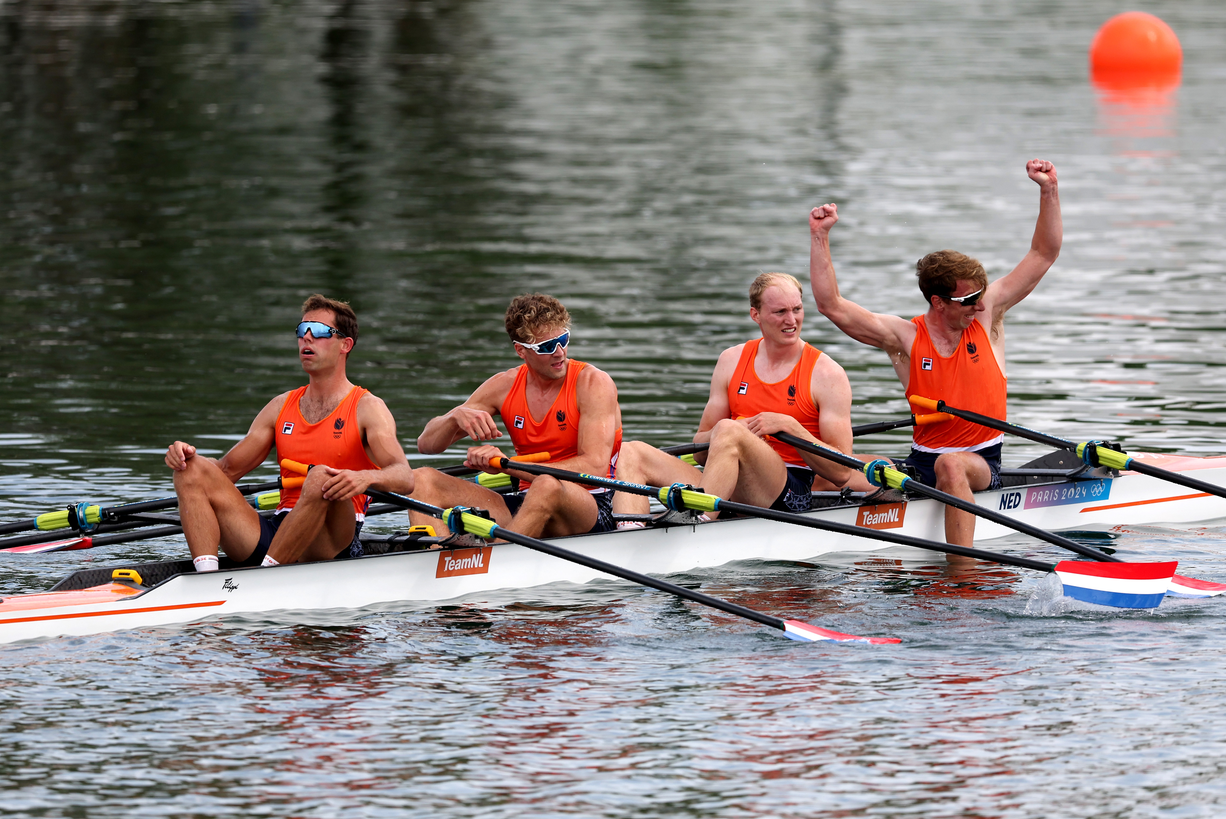 Olympic Rowers, Lennart van Lierop, Finn Florijn, Tone Wieten and Koen Metsemakers of Team Netherlands celebrate winning the gold medals after a competition.