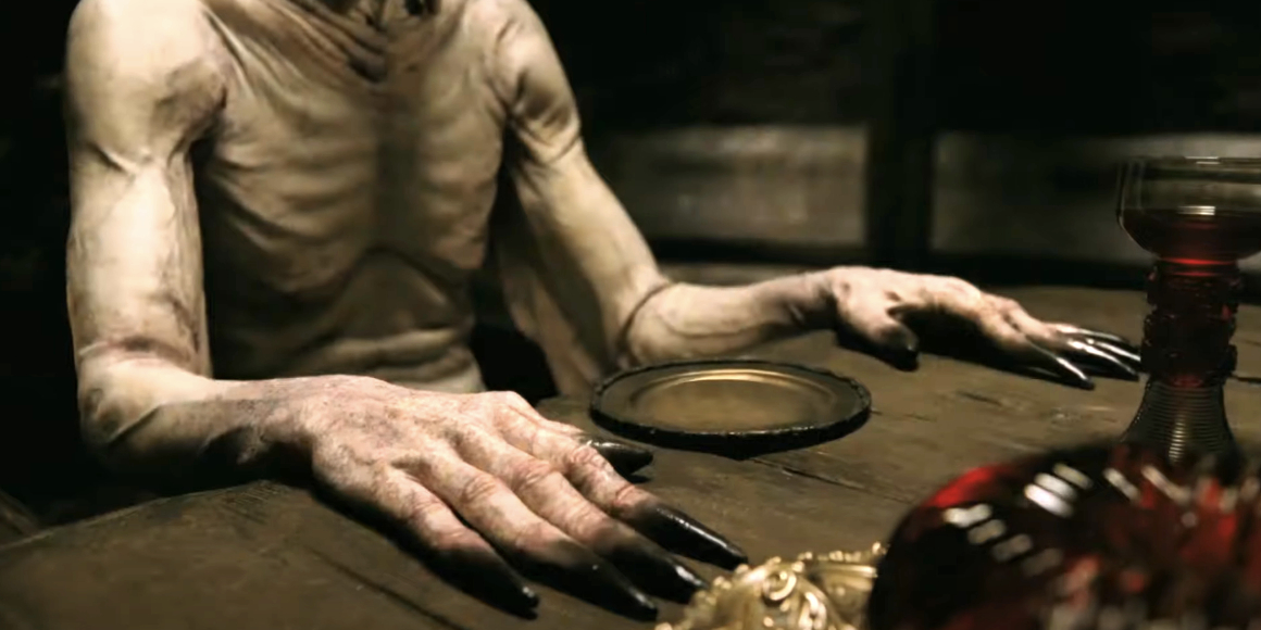 A mysterious creature with long black claws and pale, wrinkled skin sits at a wooden table next to a red goblet