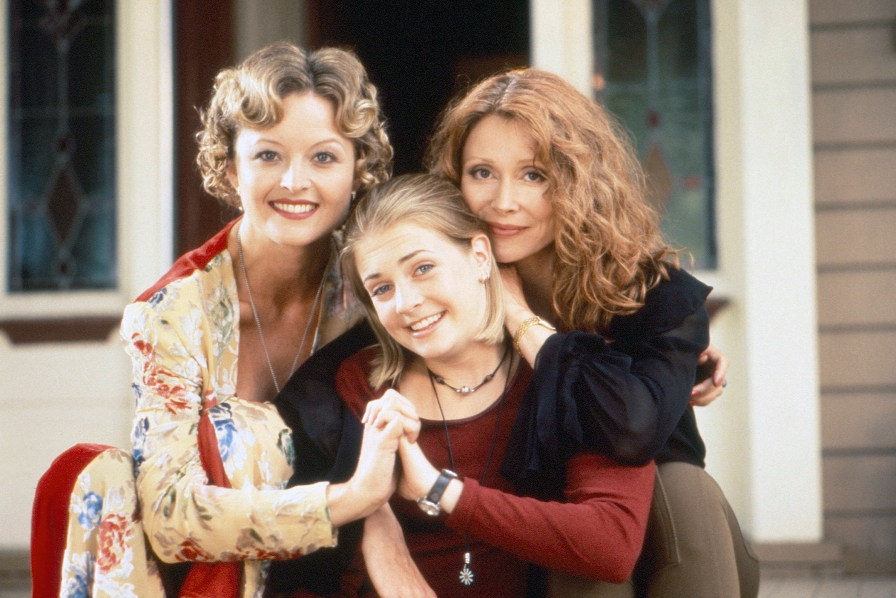 Charlene Fernetz, Melissa Joan Hart, and Sherry Miller taking a family photo together in &quot;Sabrina the Teenage Witch&quot;