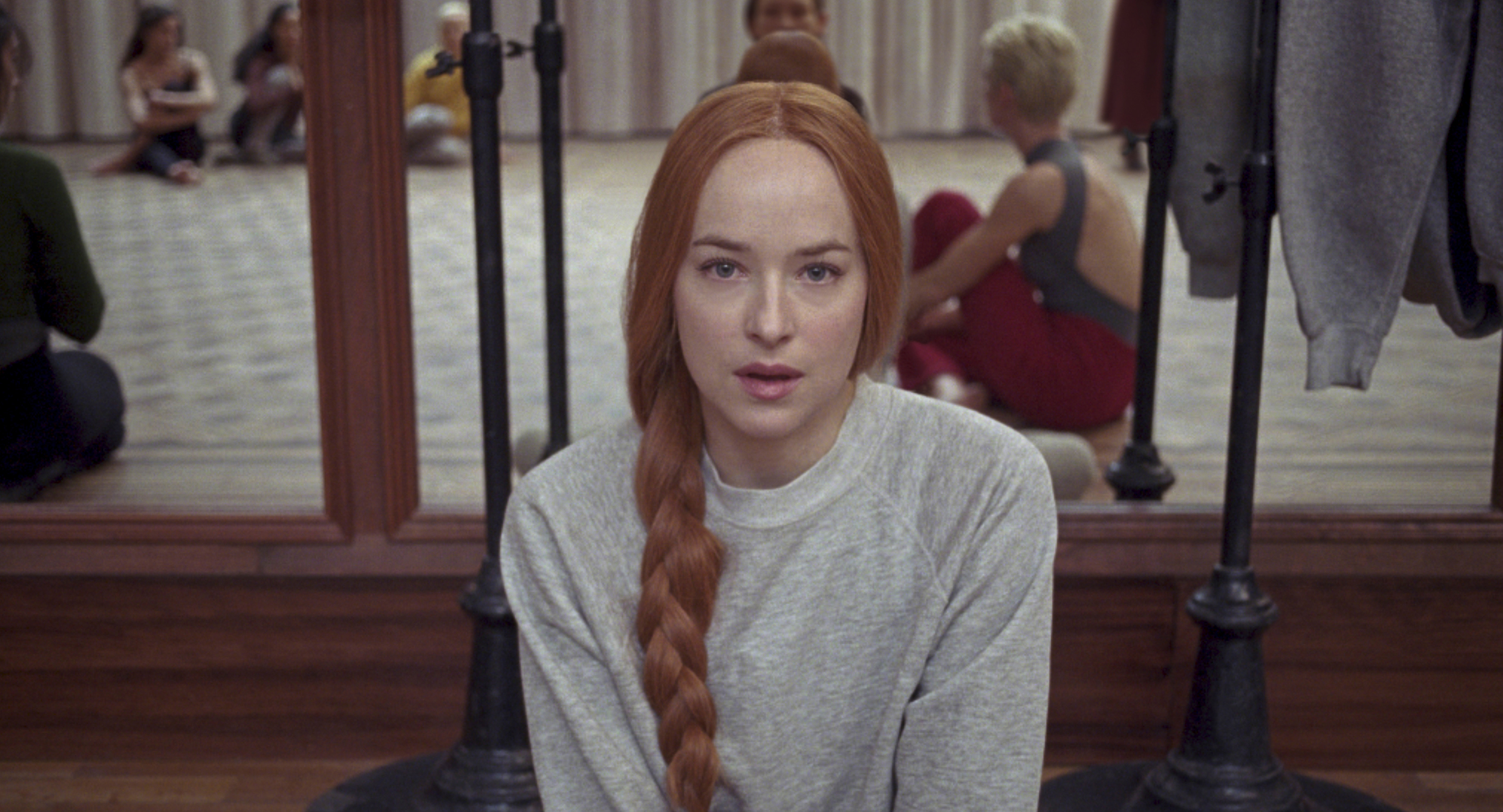 Dakota Johnson in casual clothing and a hair braid in &quot;Suspiria&quot;