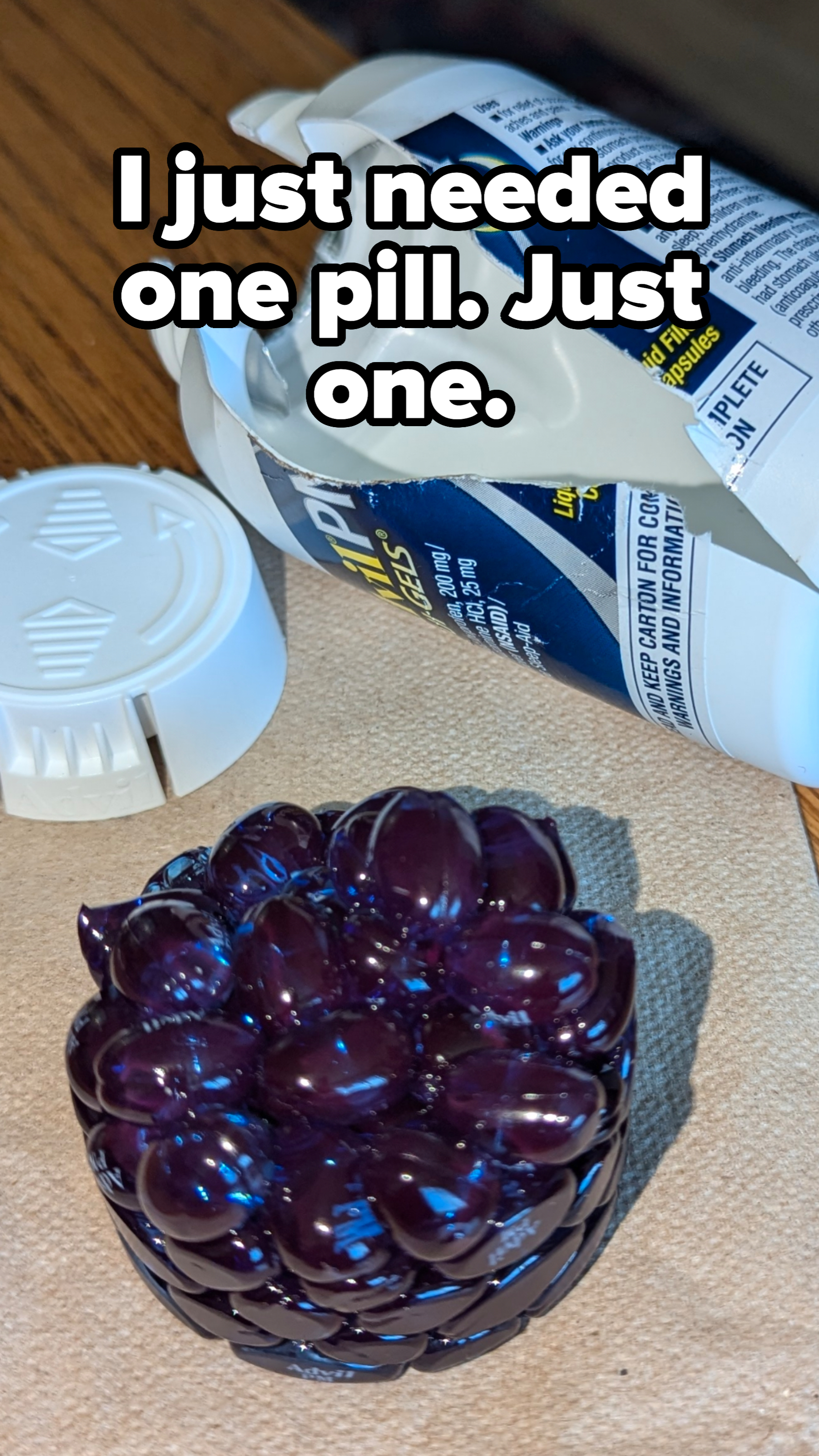 A damaged bottle of Aleve pills is shown with many pills scattered on a table