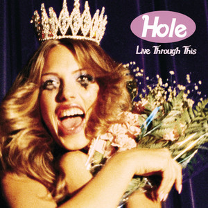 Courtney Love wearing a crown, holding a bouquet of flowers, with smeared makeup and a big smile, on the cover of the album &quot;Live Through This&quot; by Hole