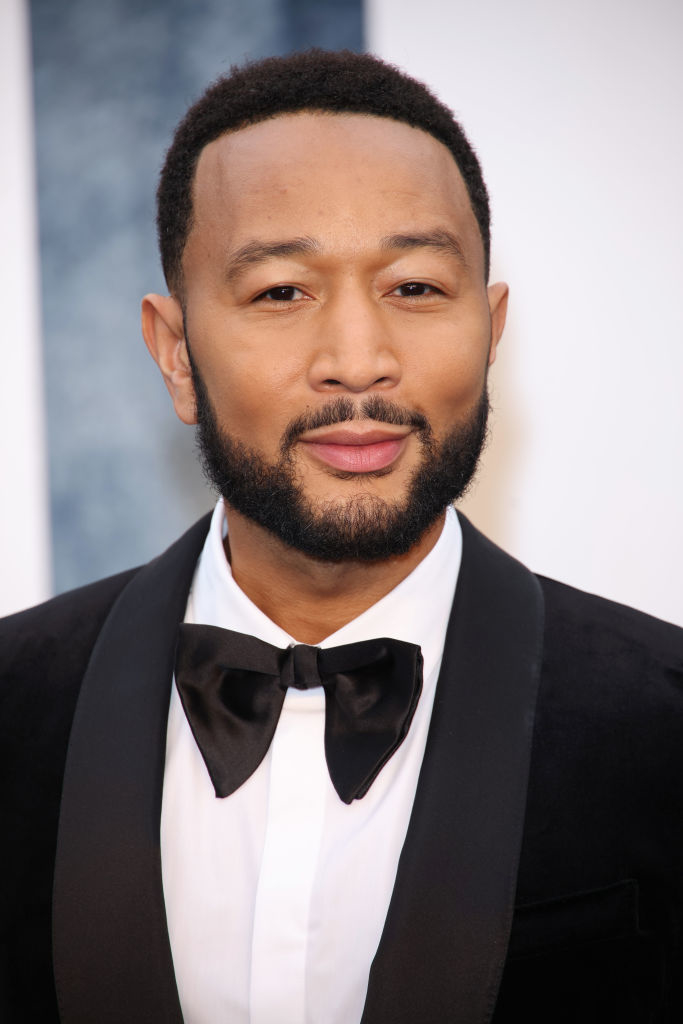 John Legend in a tuxedo with a bow tie at a formal event