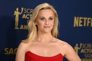 Reese Witherspoon poses on the red carpet at the Screen Actors Guild Awards in a strapless gown and minimal jewelry