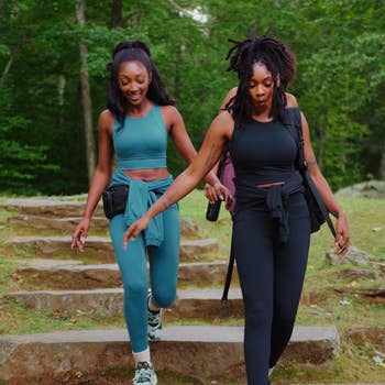 models walking in matching yanta leggings and tank sets