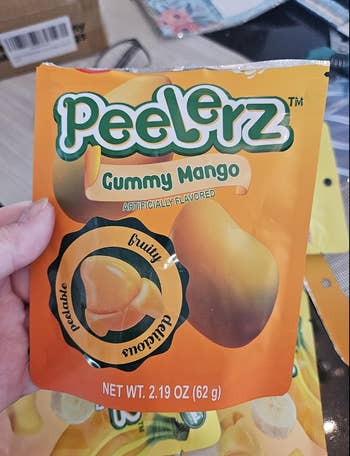 Peelerz Gummy Mango candy pack held in hand, labeled 