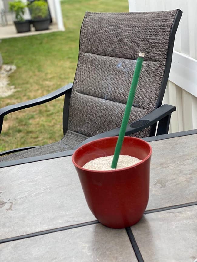 reviewer image of a smoking stick of incense in a small pot