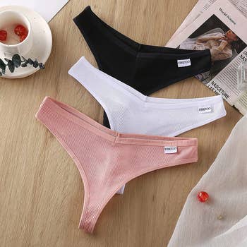 product image of three thongs in pink, white, black