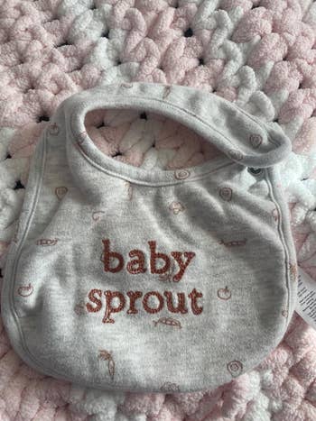 Gray baby bib with 