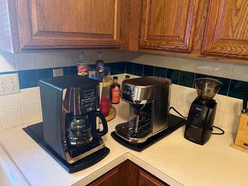 Kitchen counter with coffee maker, toaster, and grinder. Perfect for creating a cozy breakfast nook