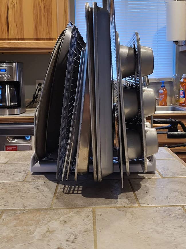 reviewer photo of various bakeware items organized on rack