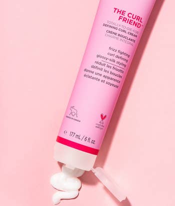 A pink jar of curl cream 