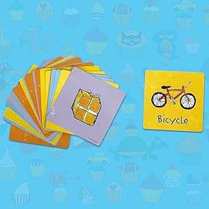 Flashcards scattered with pictures of various objects, including one card showing a bicycle