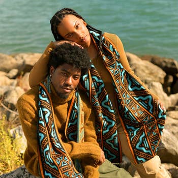 models in orange and blue oversize scarf