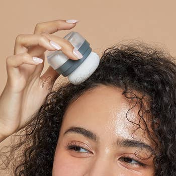 a model applying the powder to their roots