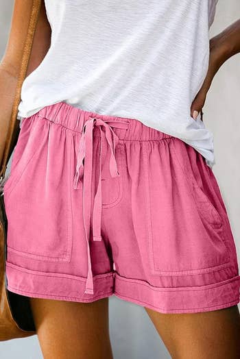 Person in hot pink shorts with drawstring 